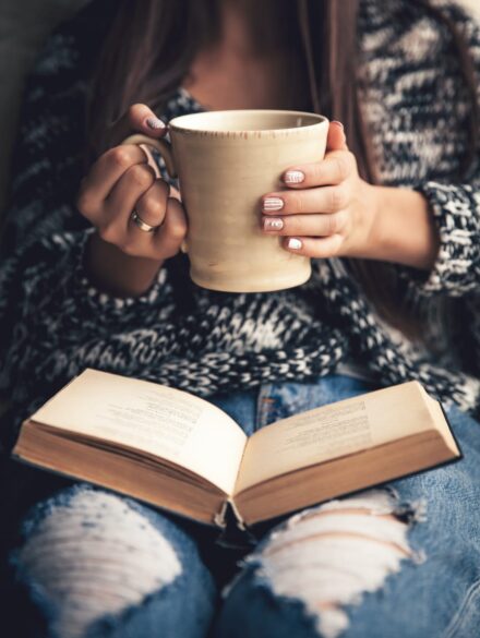 girl-having-a-break-with-cup-of-fresh-coffee-after-46BEHL3